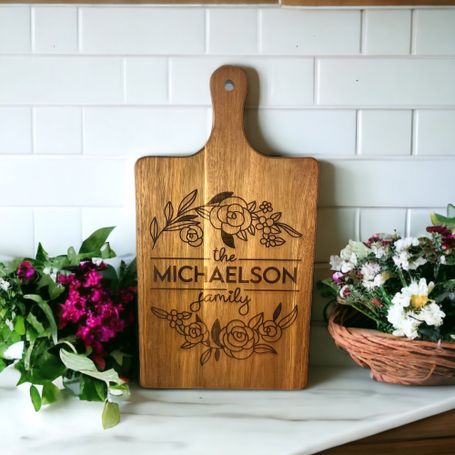 a custom order family name cutting board on a counter in a kitchen