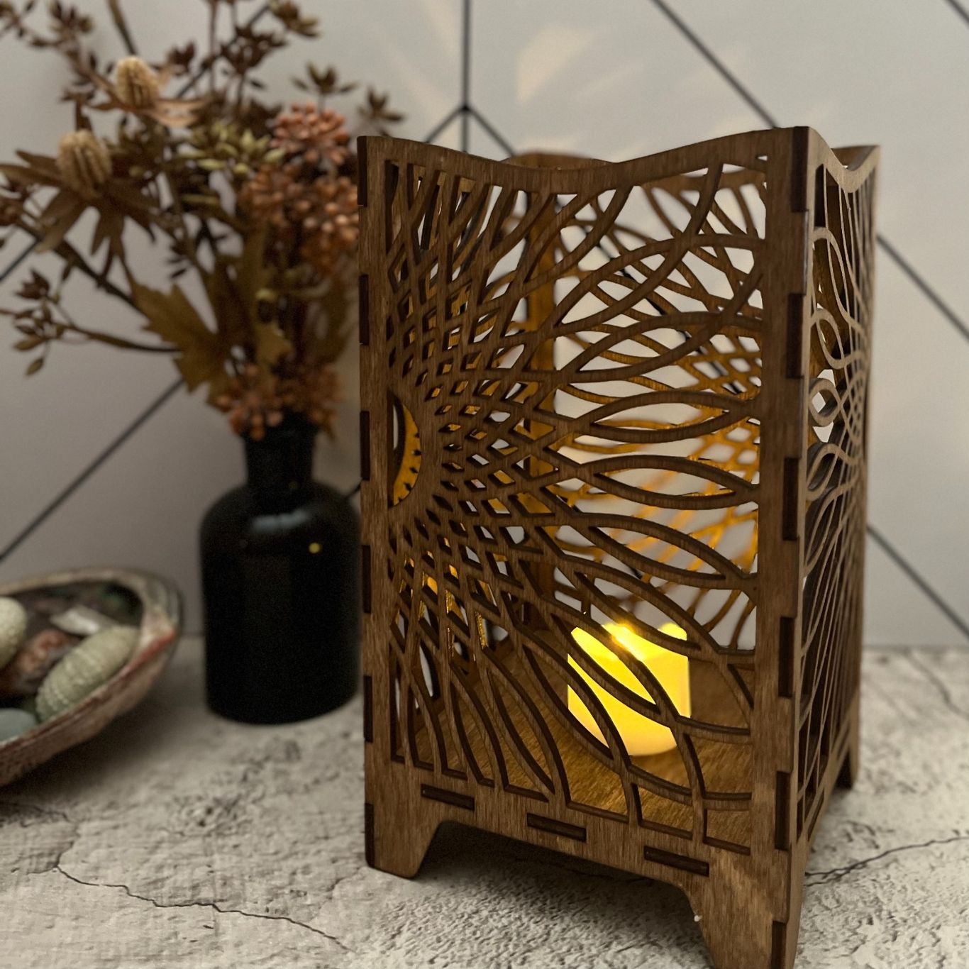 Photo of laser cut wooden lantern with sunflower design. 